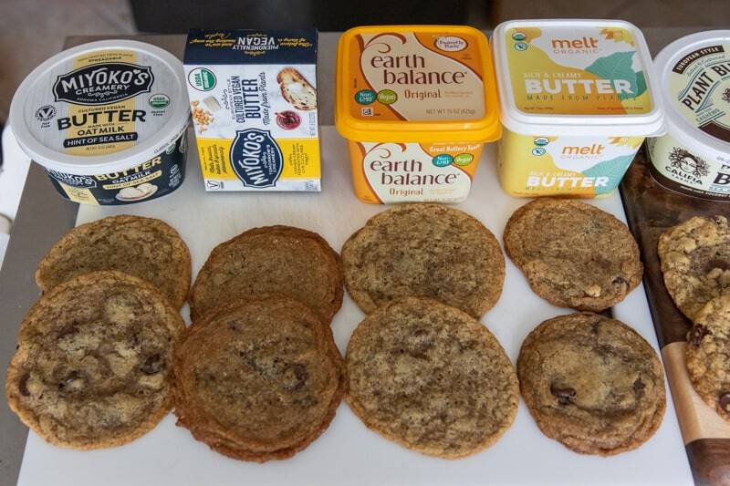a lineup of vegan chocolate chip cookies with different brands of vegan butter