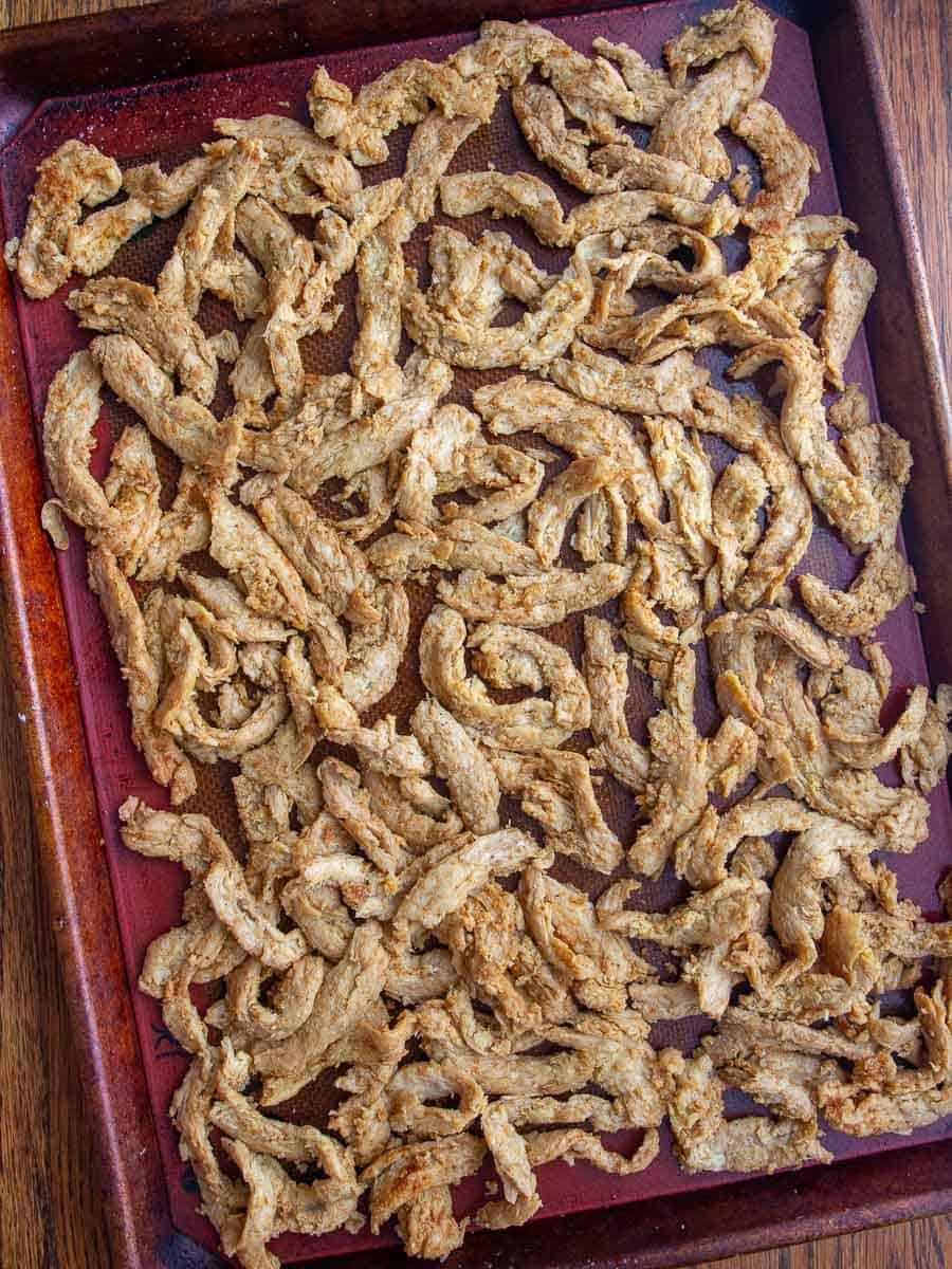 overhead shot of seasoned soy curls ready to bake