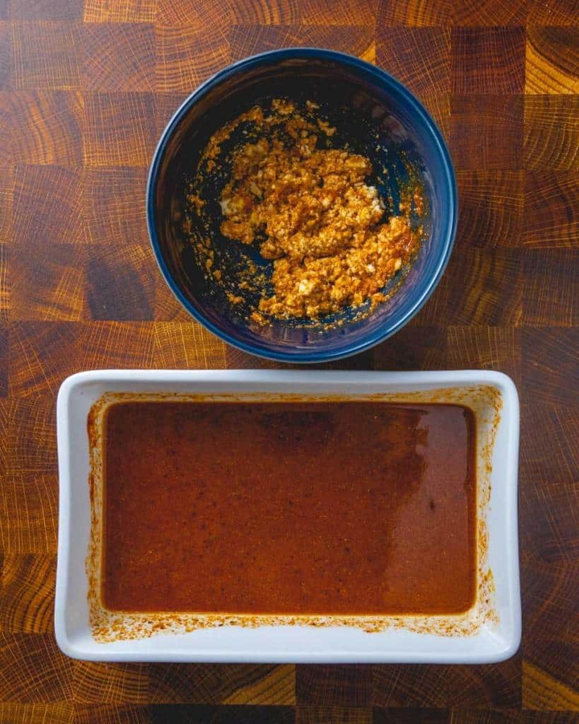 marinated crumbled tofu in a blue bowl; bacon marinade in a baking dish