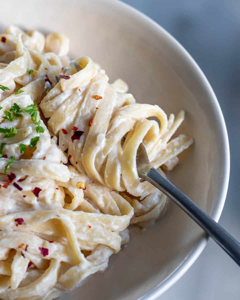 closeup shot of noodles wrapped around fork to show texture