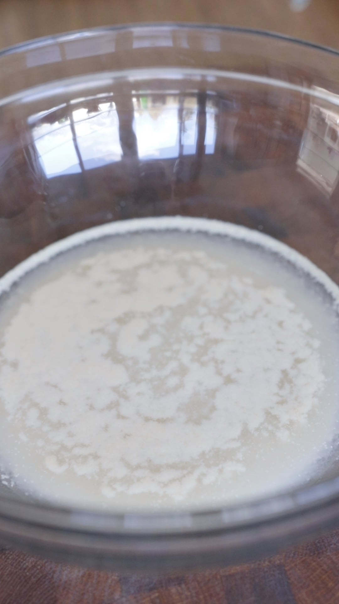 yeast proofing in a large glass mixing bowl