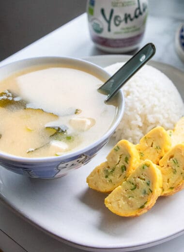 vegan miso soup in a bowl served with rice and tamagoyaki