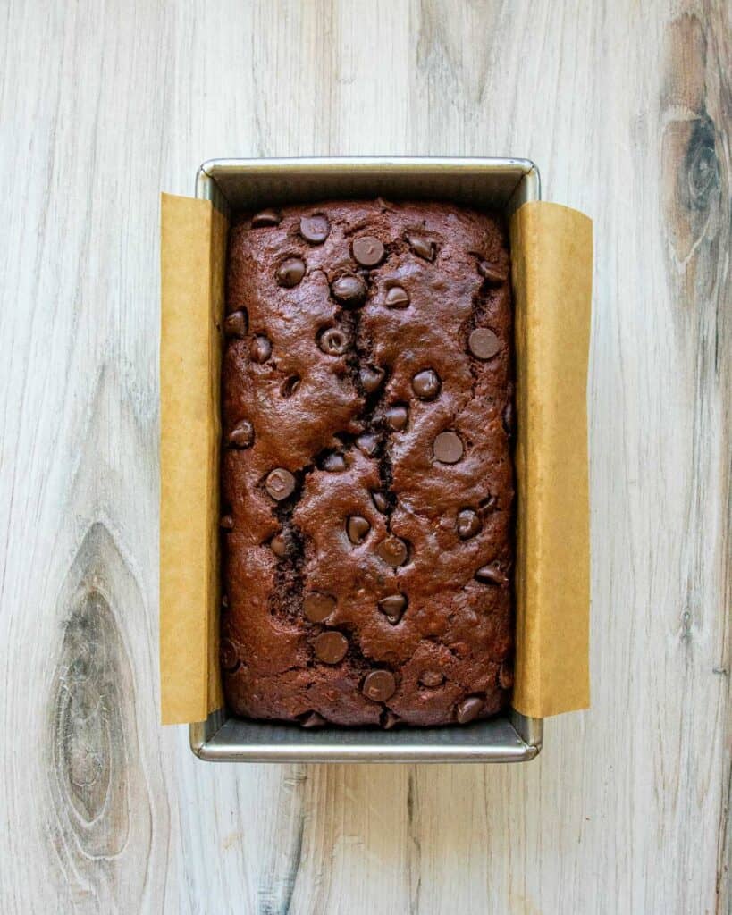 a loaf of double chocolate vegan banana bread in a loaf pan
