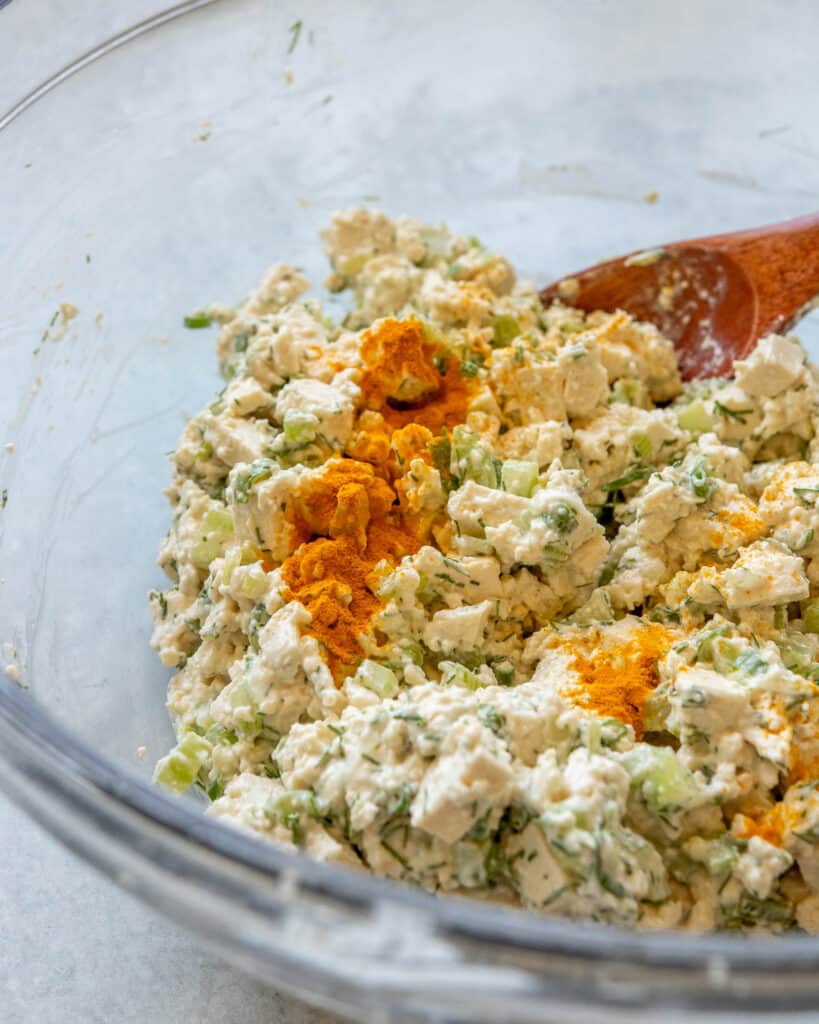 A closeup shot of vegan egg salad with turmeric added to boost the color.
