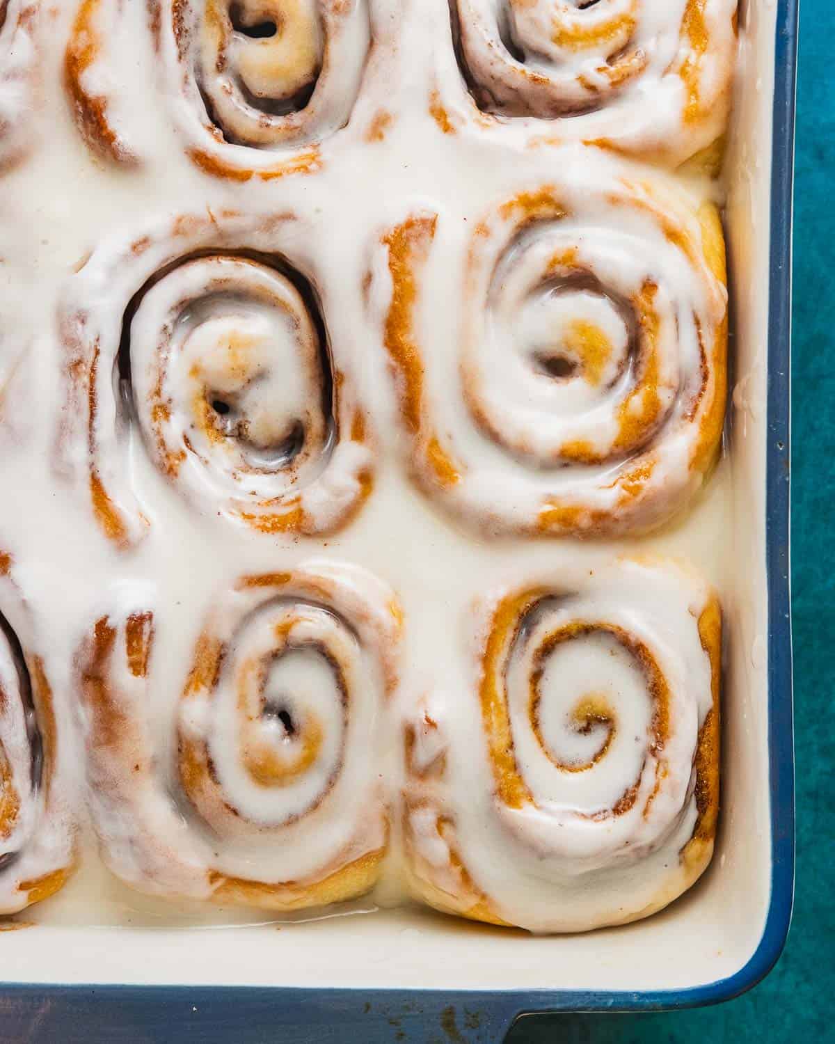 overhead shot of vegan cinnamon rolls in a baking dish