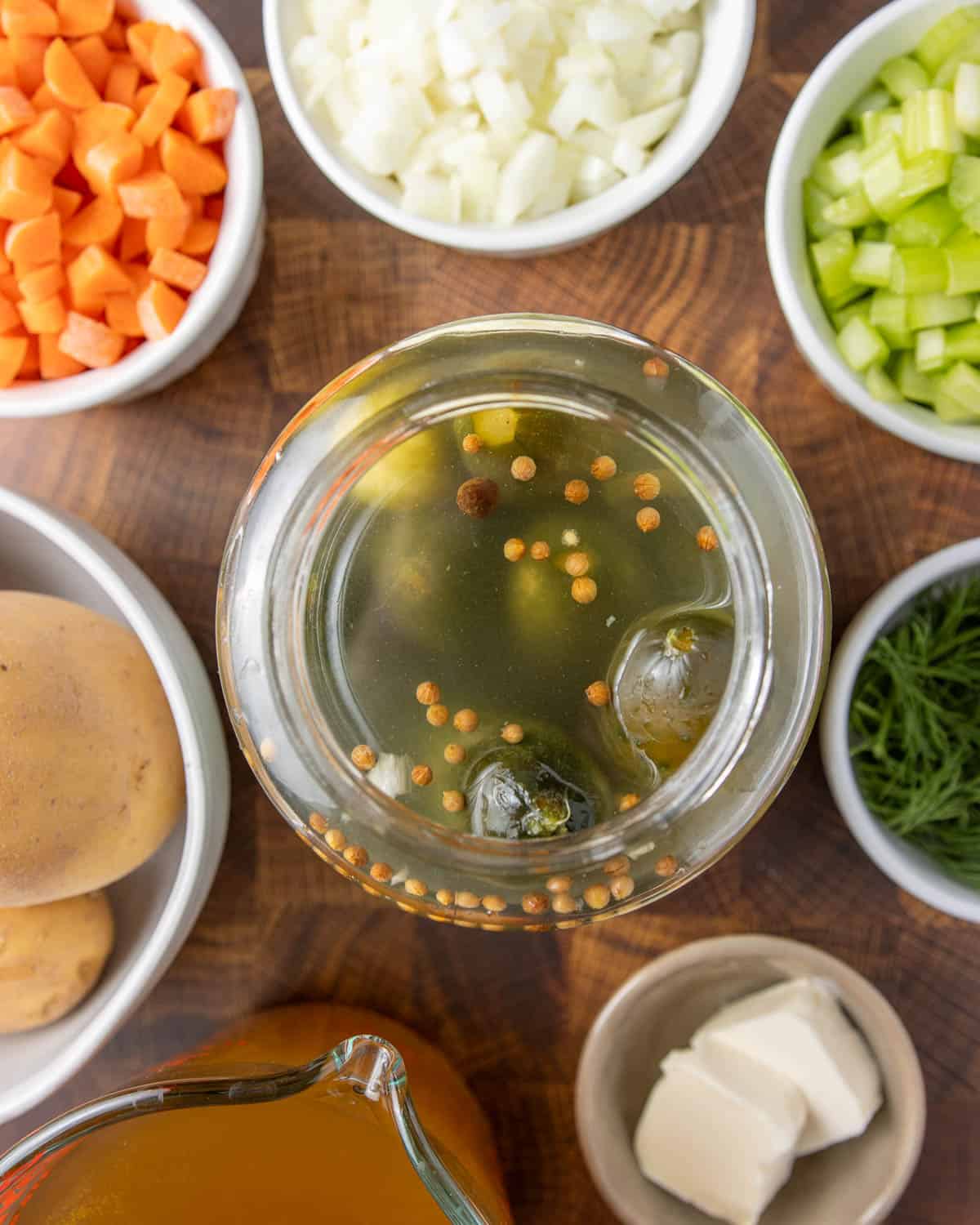 a close-up overhead shot of the inside of a jar of pickles