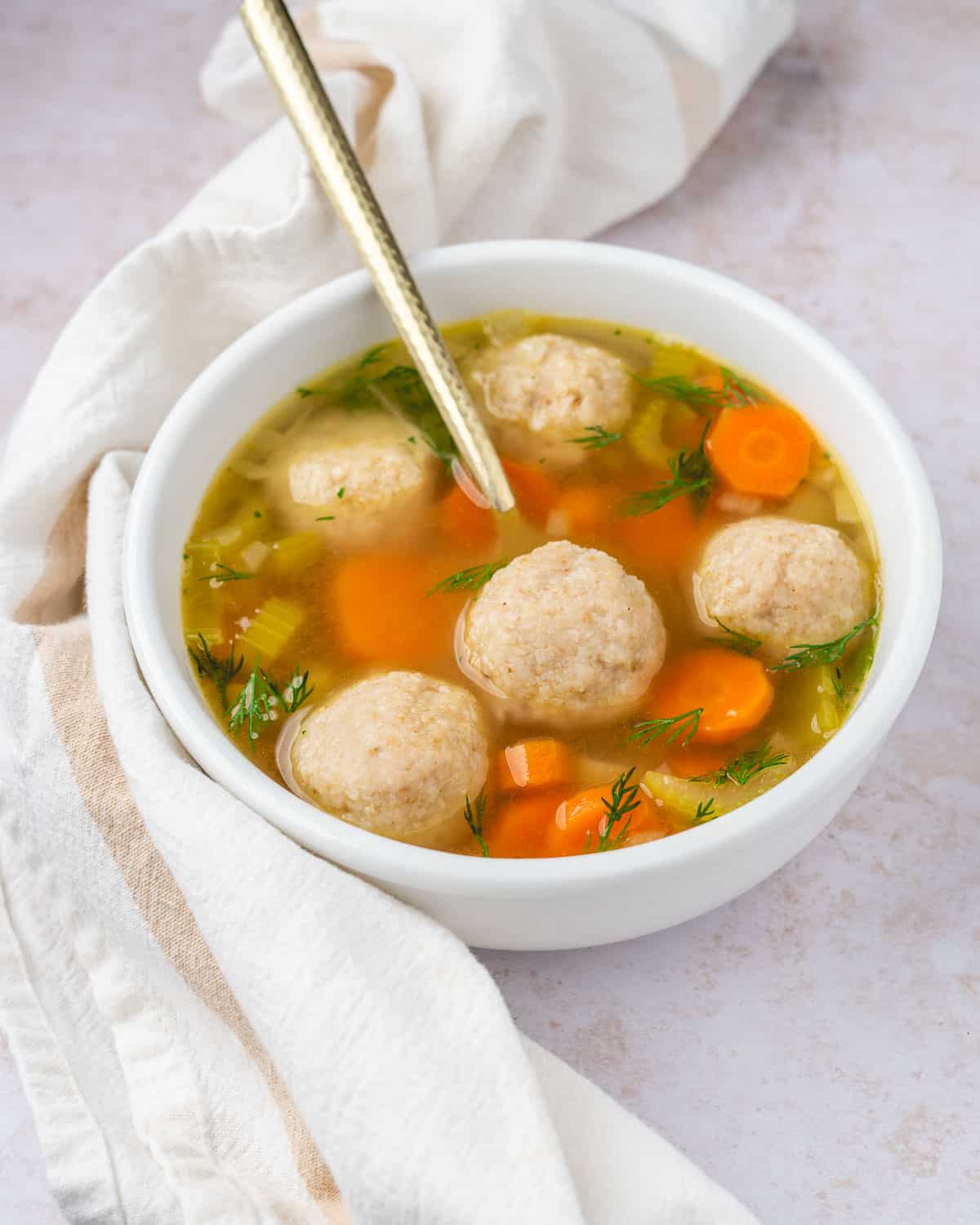 a bowl of vegan matzo ball soup