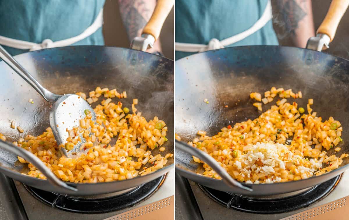 onion, scallions, garlic, and ginger being stir-fried in a carbon steel wok