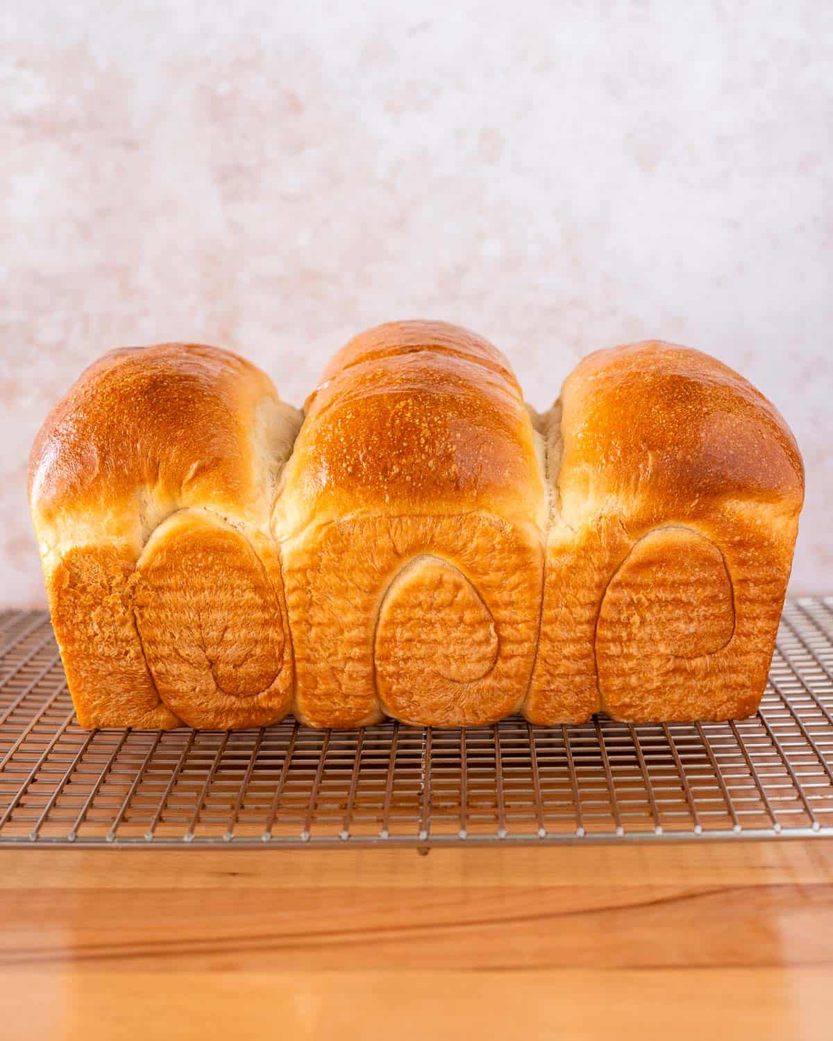 side angle shot of a loaf of vegan milk bread