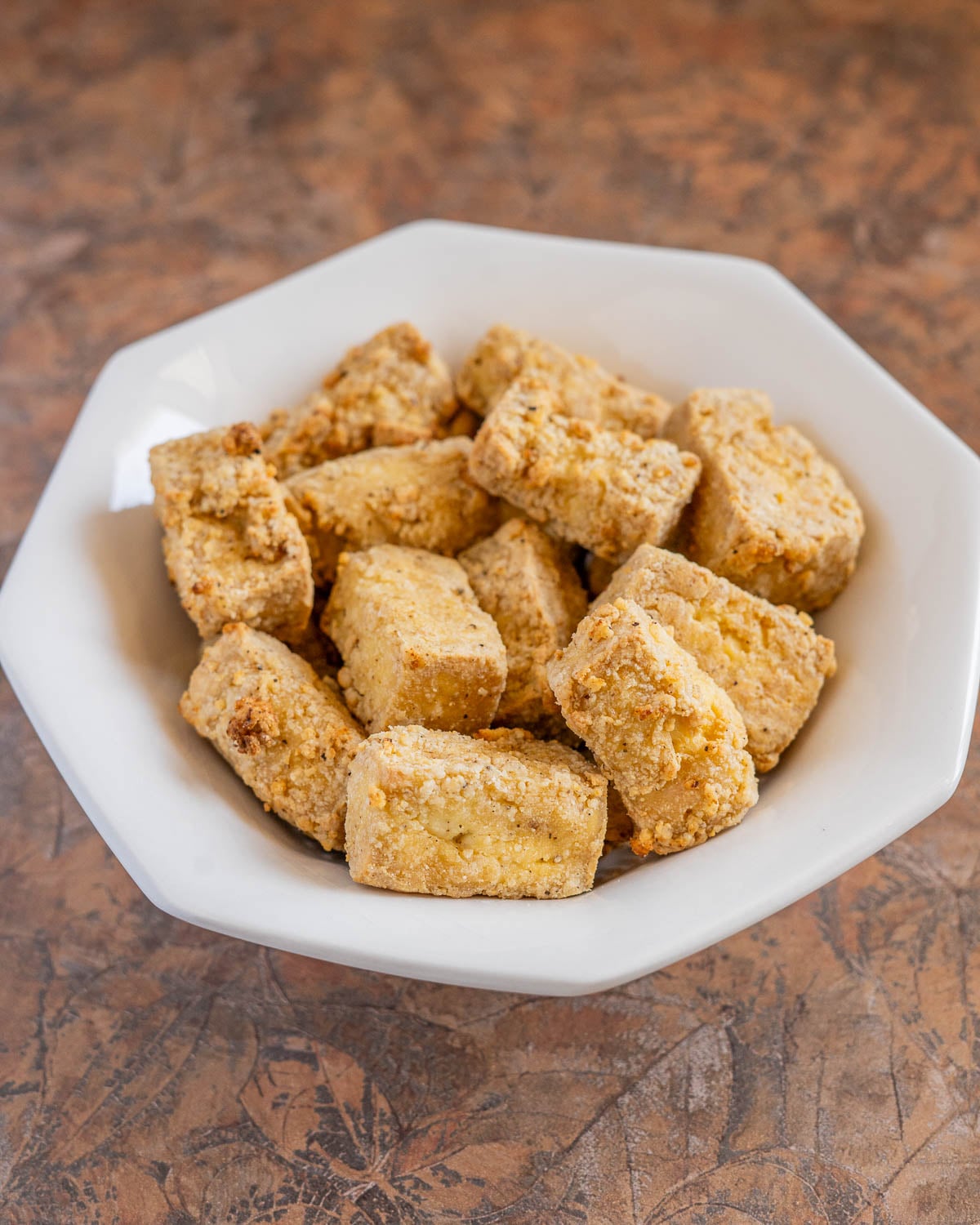 a bowl of crispy air fried tofu nuggets