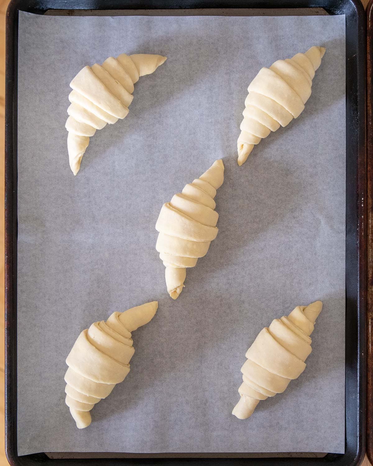 uncooked vegan croissants on a baking tray