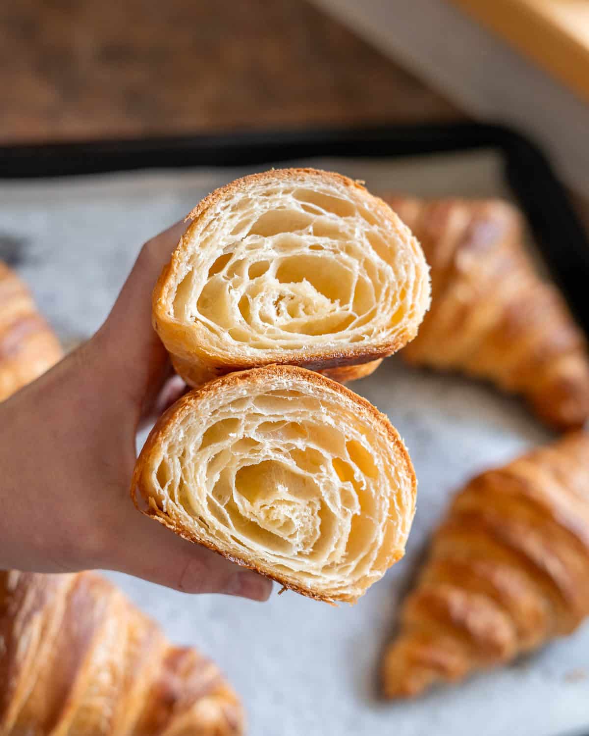 cross-section of a vegan croissant with the flaky layers visible
