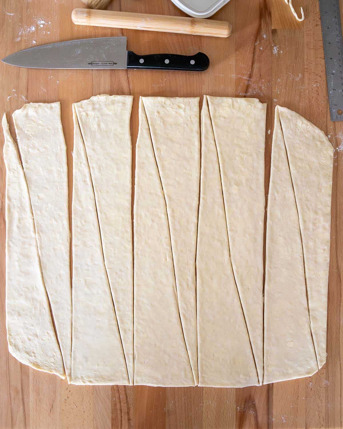 croissant dough cut into long triangles