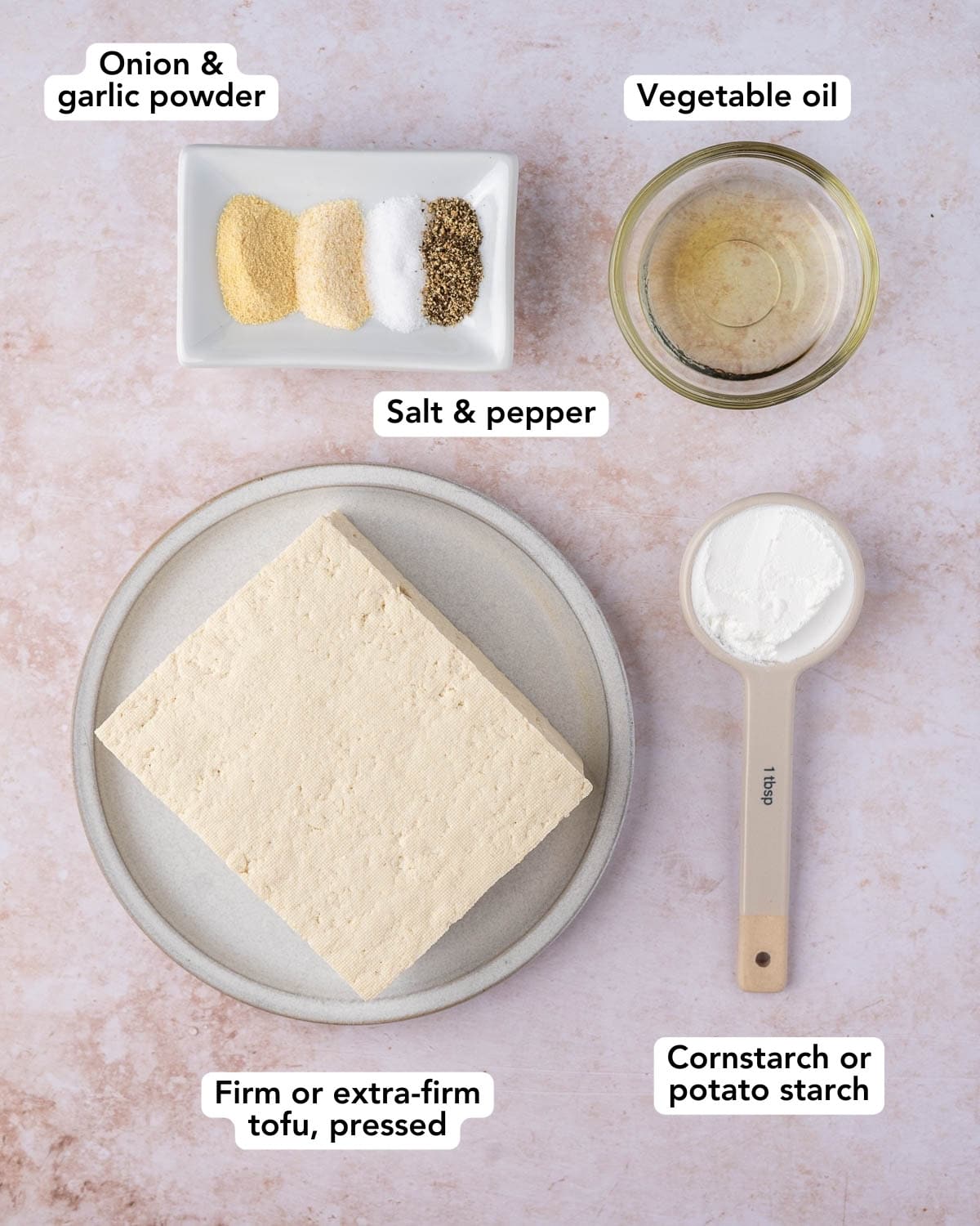 Ingredients for air fryer or baked tofu. Spices, oil, tofu and cornstarch.