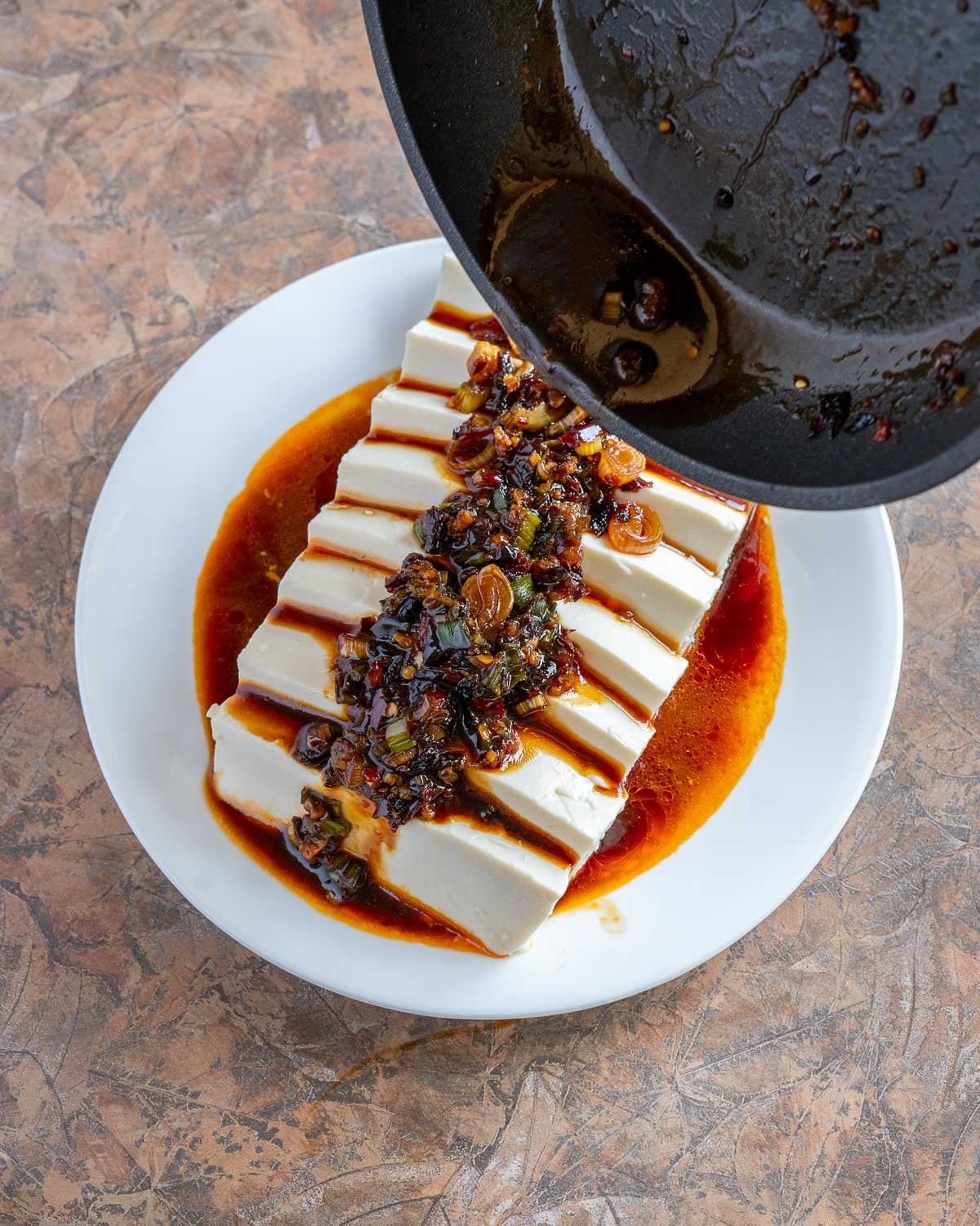 Pour sauce over tofu