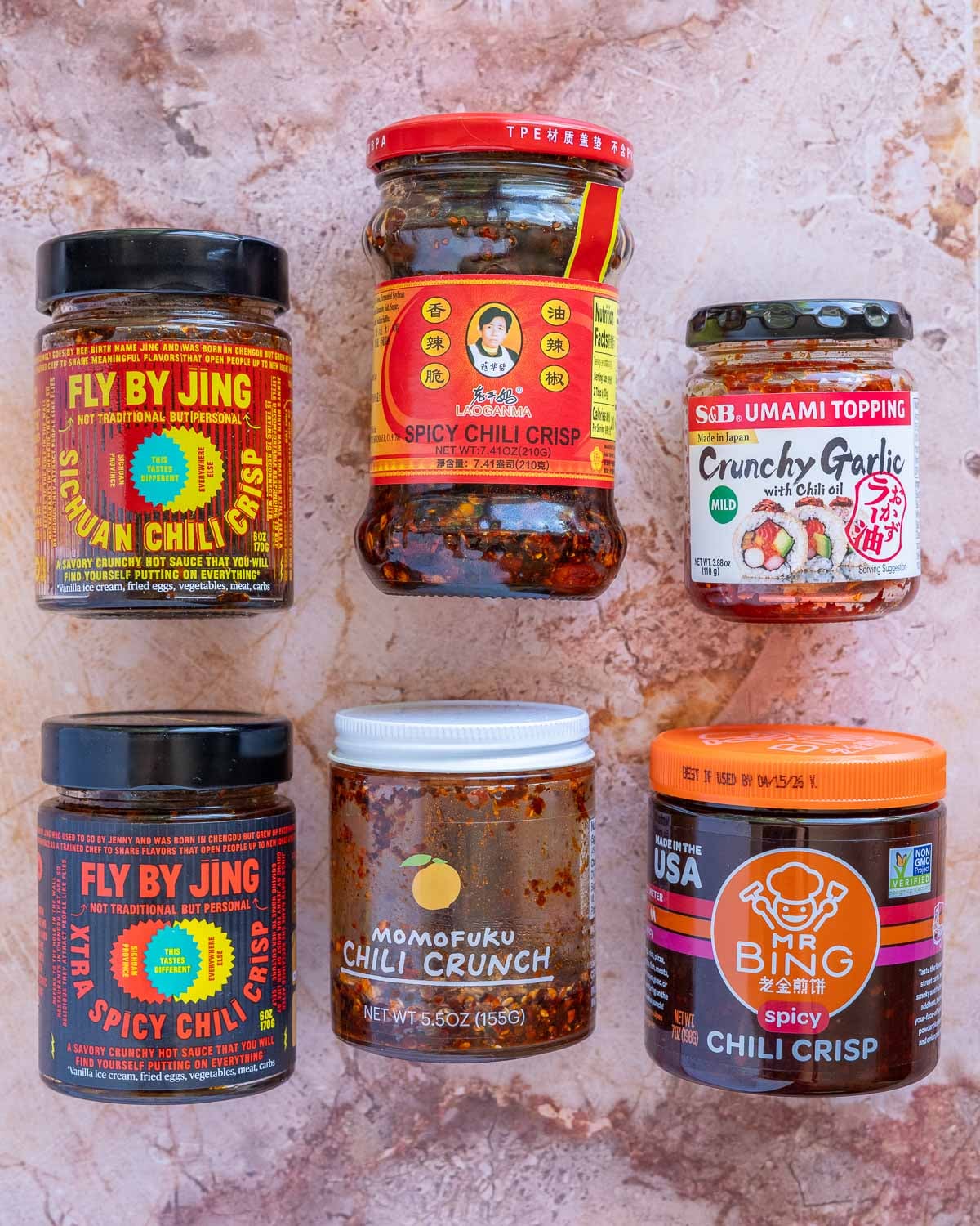 Different brands of chili crunch side-by-side