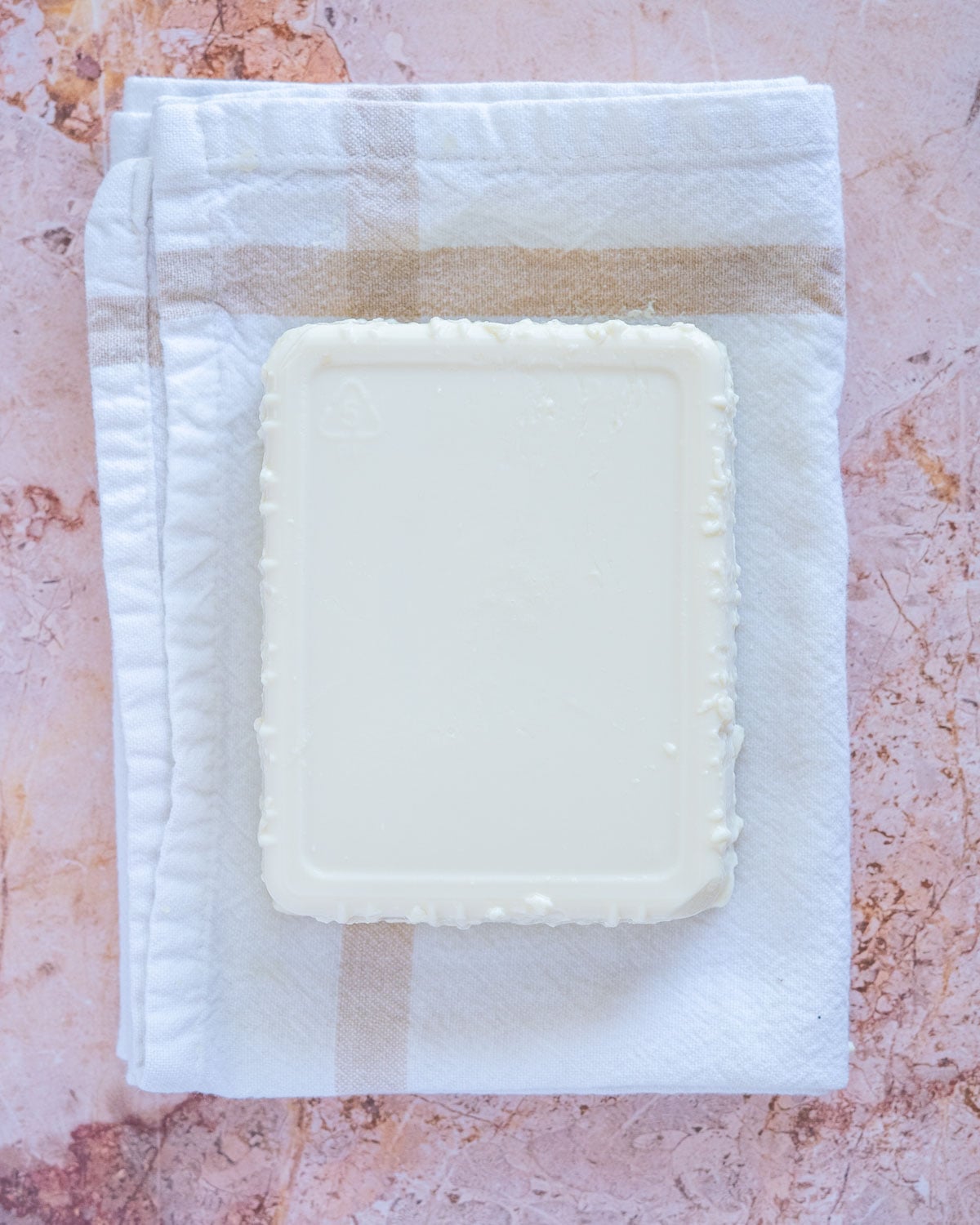 silken tofu removed from package and placed on towel to blot