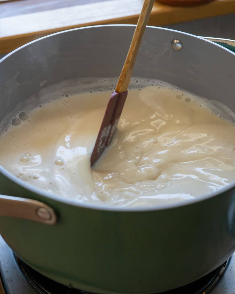 Boiling soy milk and stirring frequently