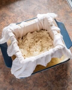 Soybean curds transferred to tofu mold