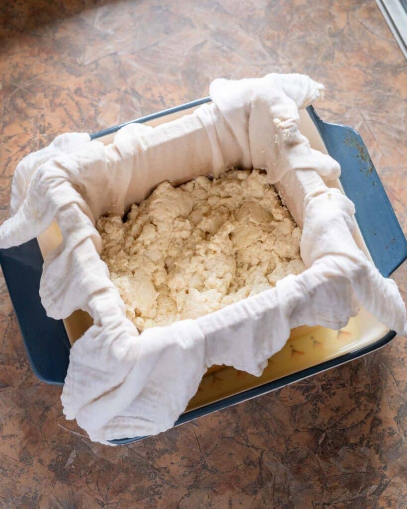 Soybean curds transferred to tofu mold