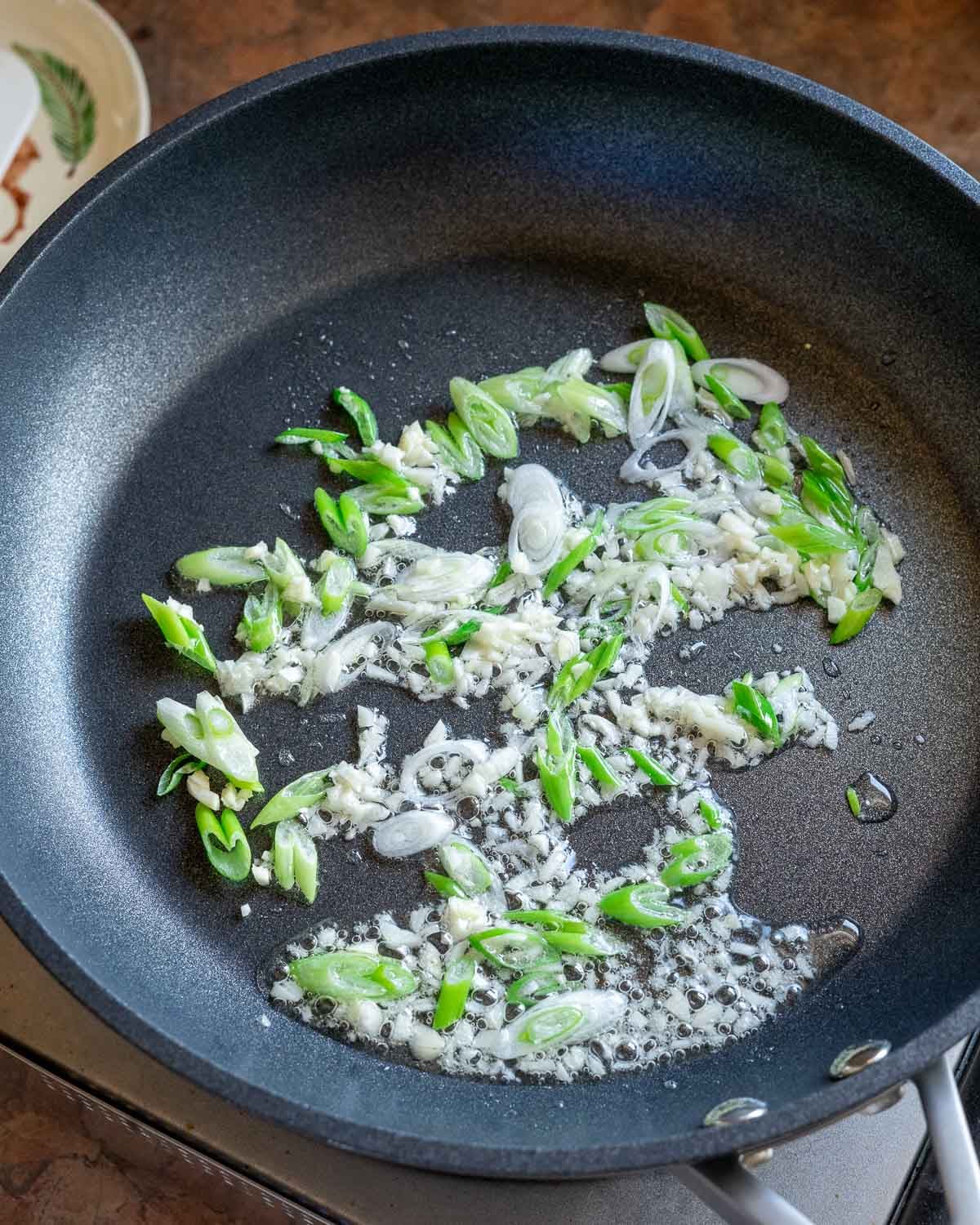 Sauté aromatics in oil