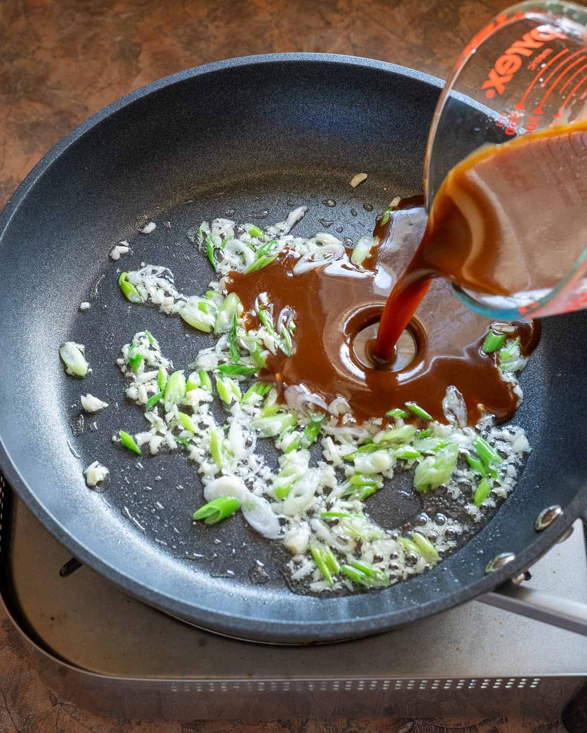 Add sauce to aromatics