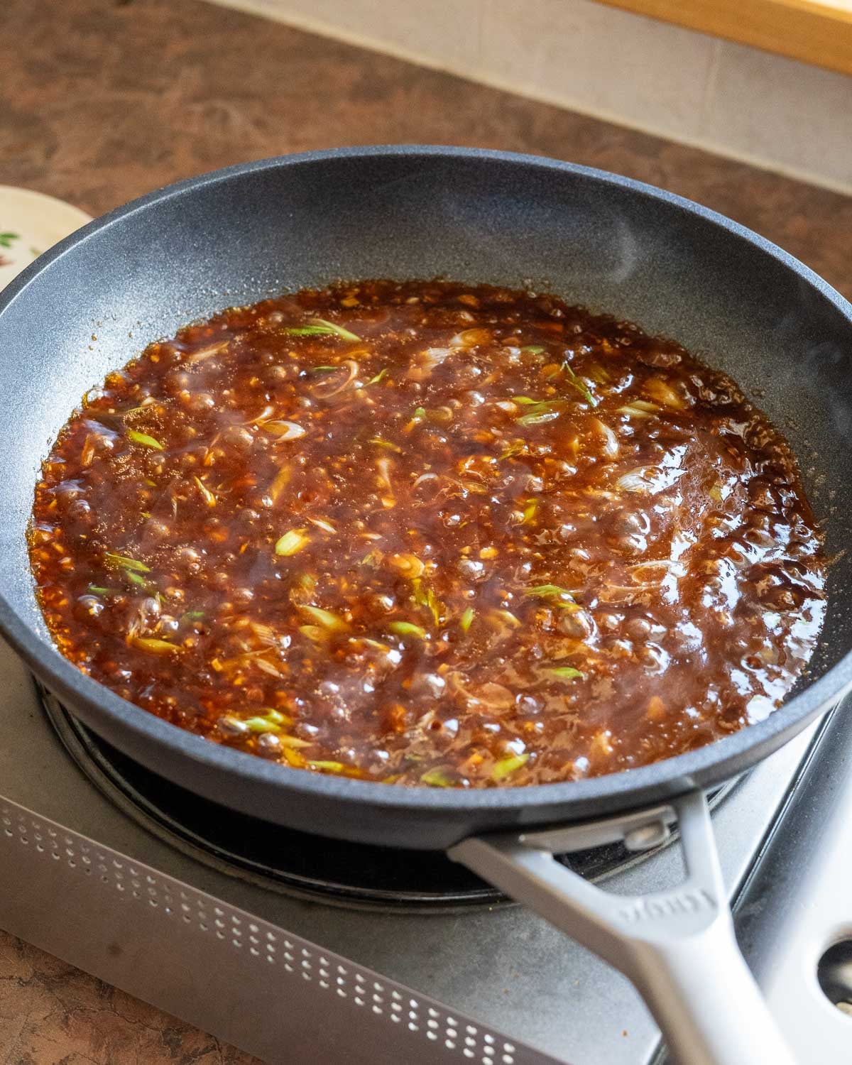 Simmer sauce until thickened