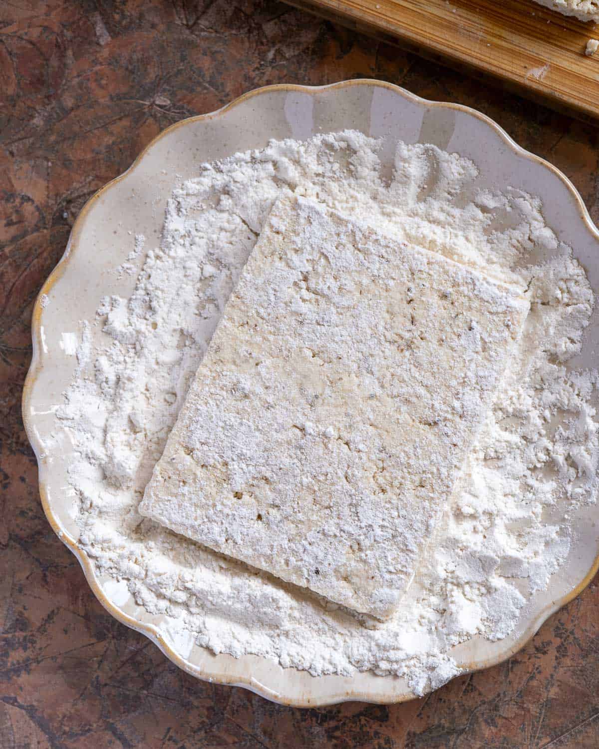 Dredge tofu in flour