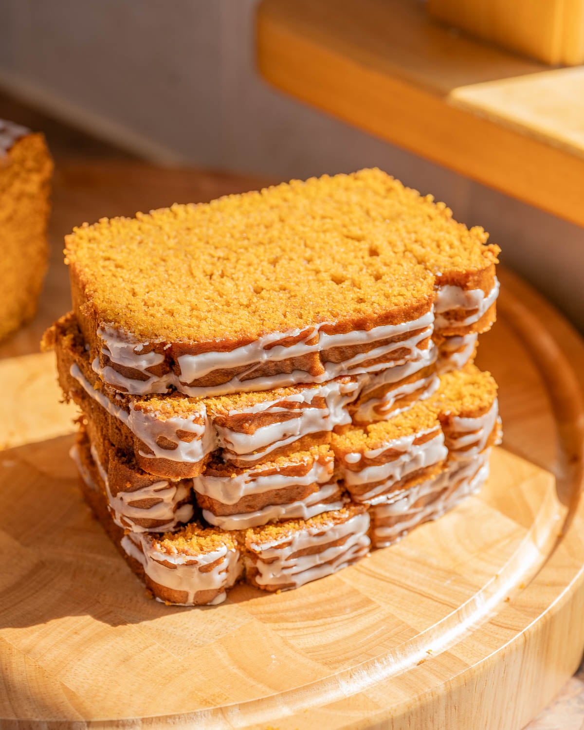 a stack of four slices of vegan pumpkin bread