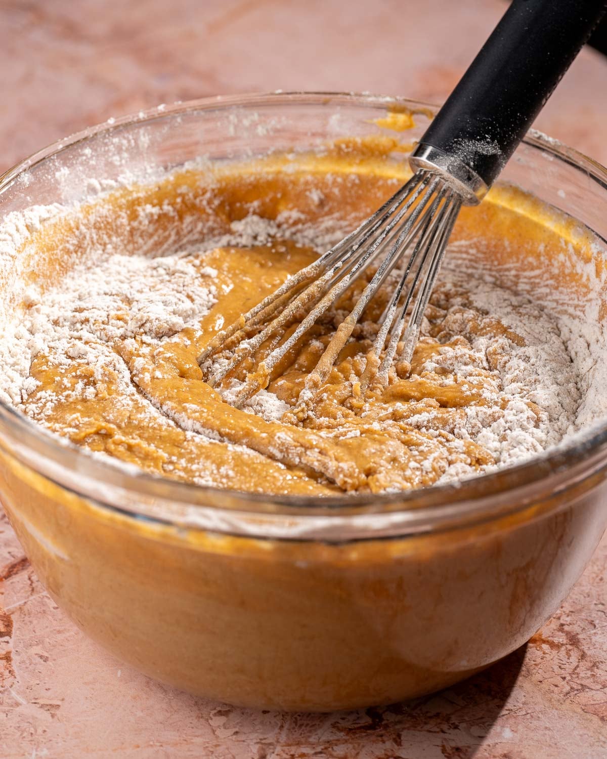 mixing dry ingredients into the batter