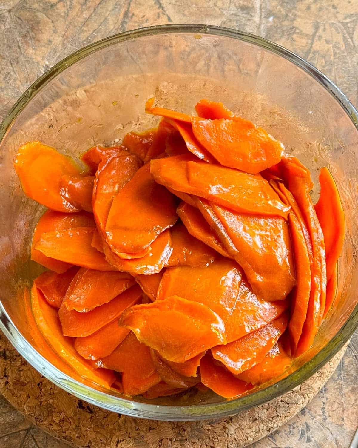 carrots tossed with marinade ready to go into fridge