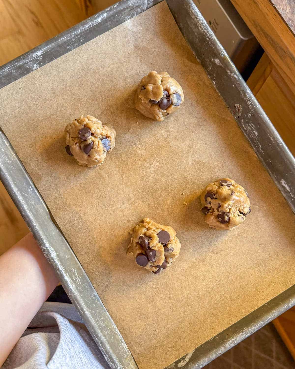 4 cookies on a baking tray