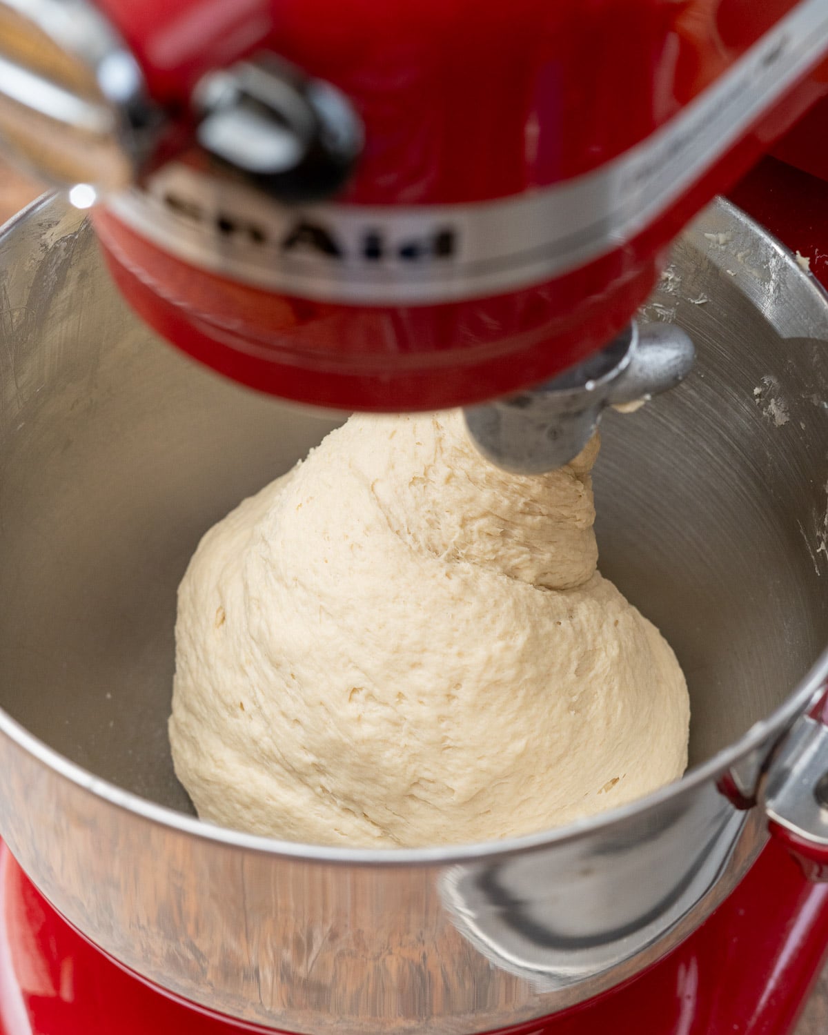 Dough in stand mixer being kneaded