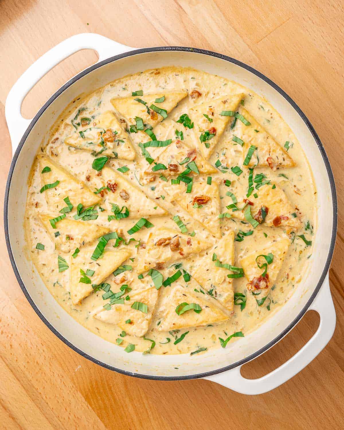 overhead shot of marry me tofu in the pan, garnished with basil