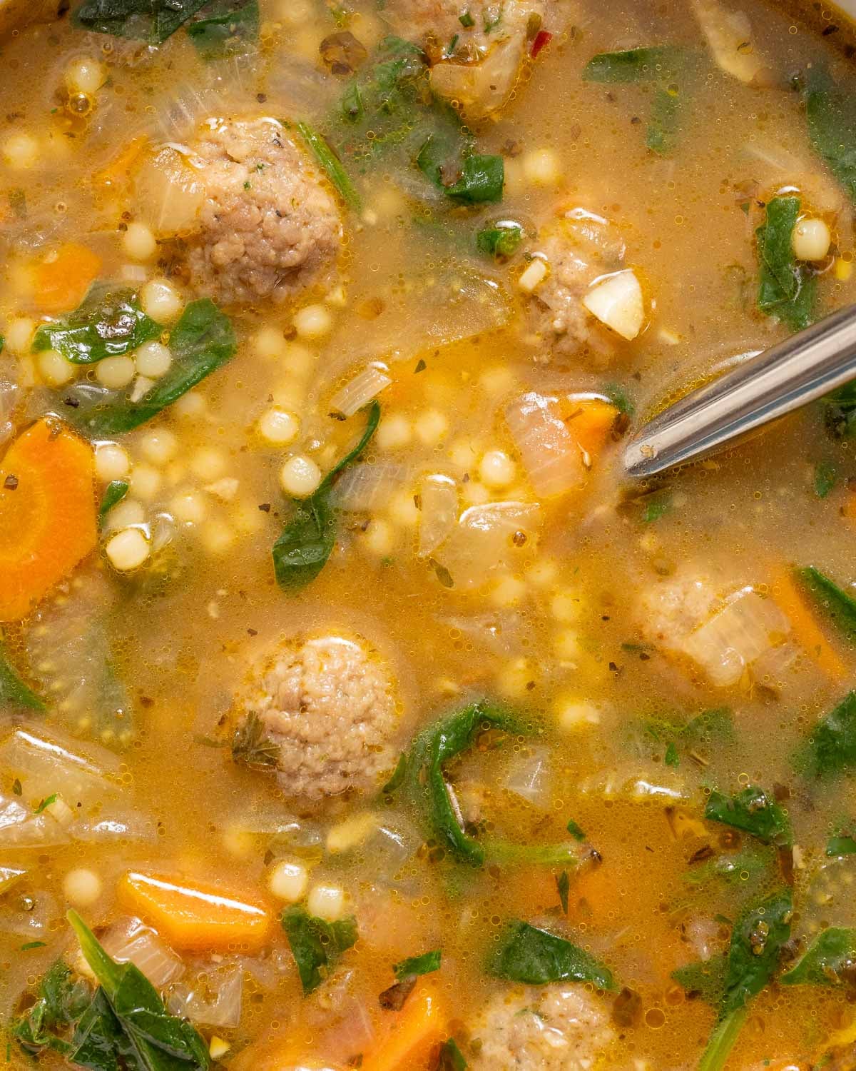 macro shot of Italian wedding soup to show the texture of the pasta
