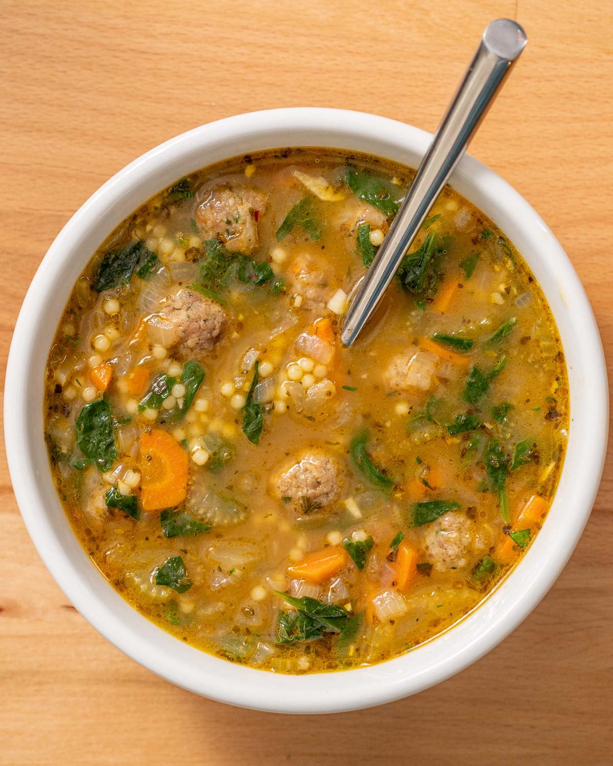 overhead shot of Italian wedding soup in a bowl ready to enjoy