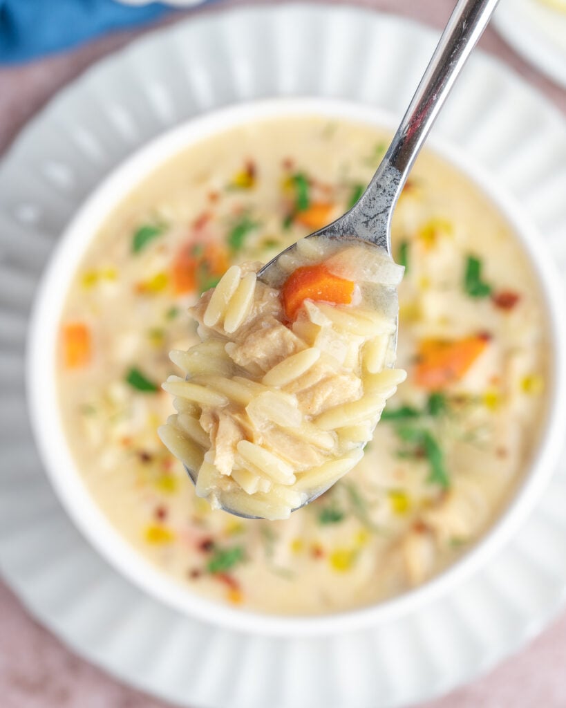 closeup spoonful of vegan lemon chicken soup