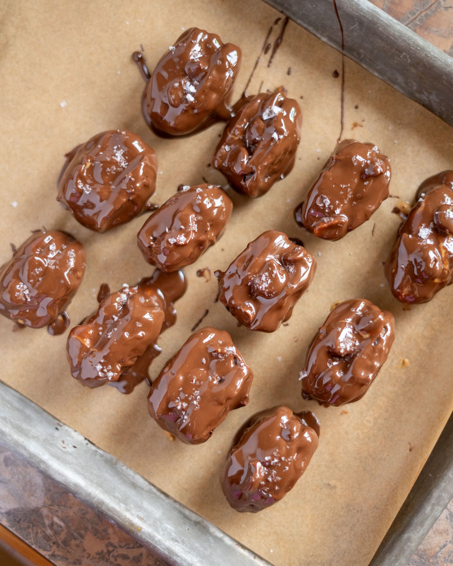 a tray of chocolate covered date Snickers