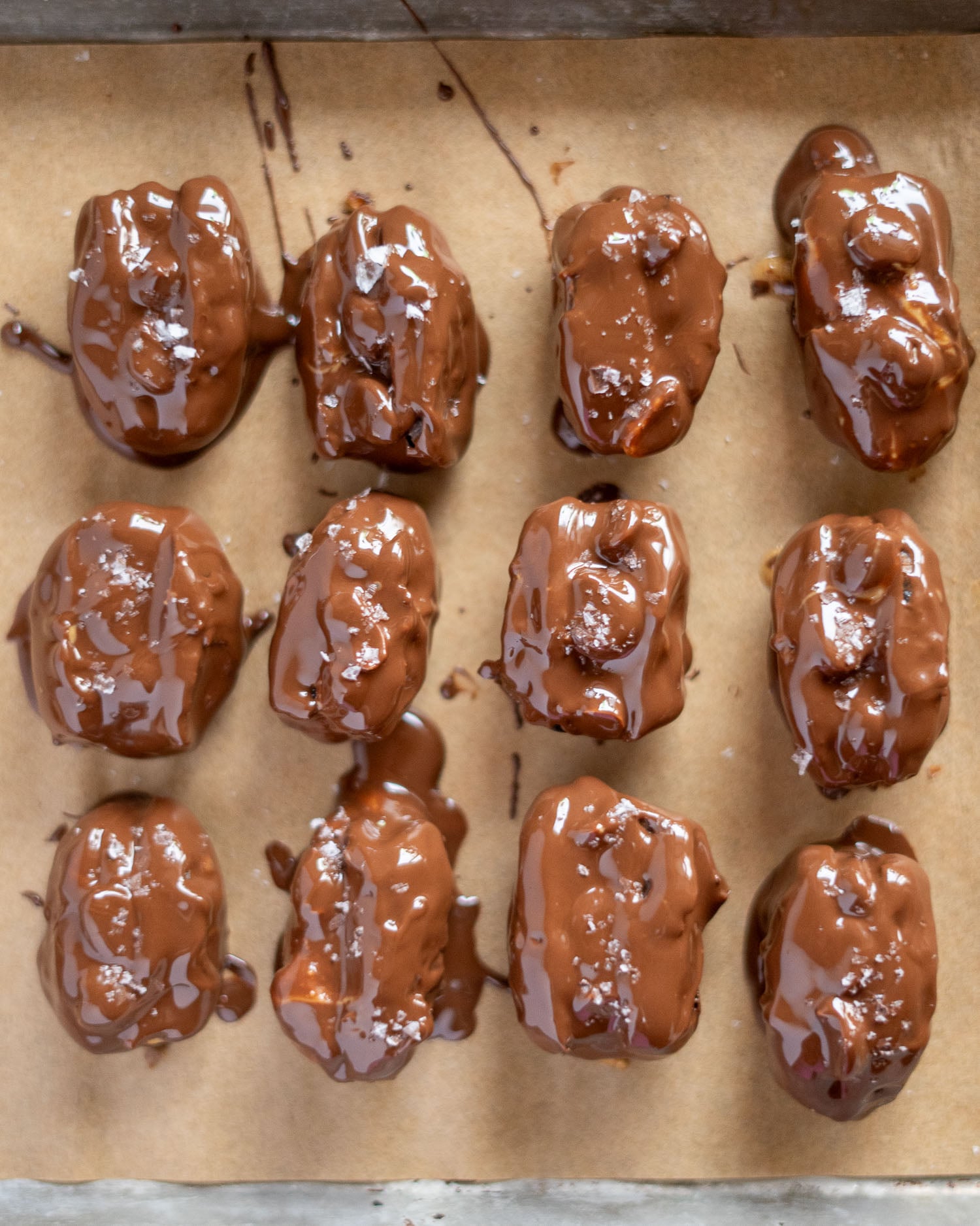 a tray of chocolate covered date Snickers
