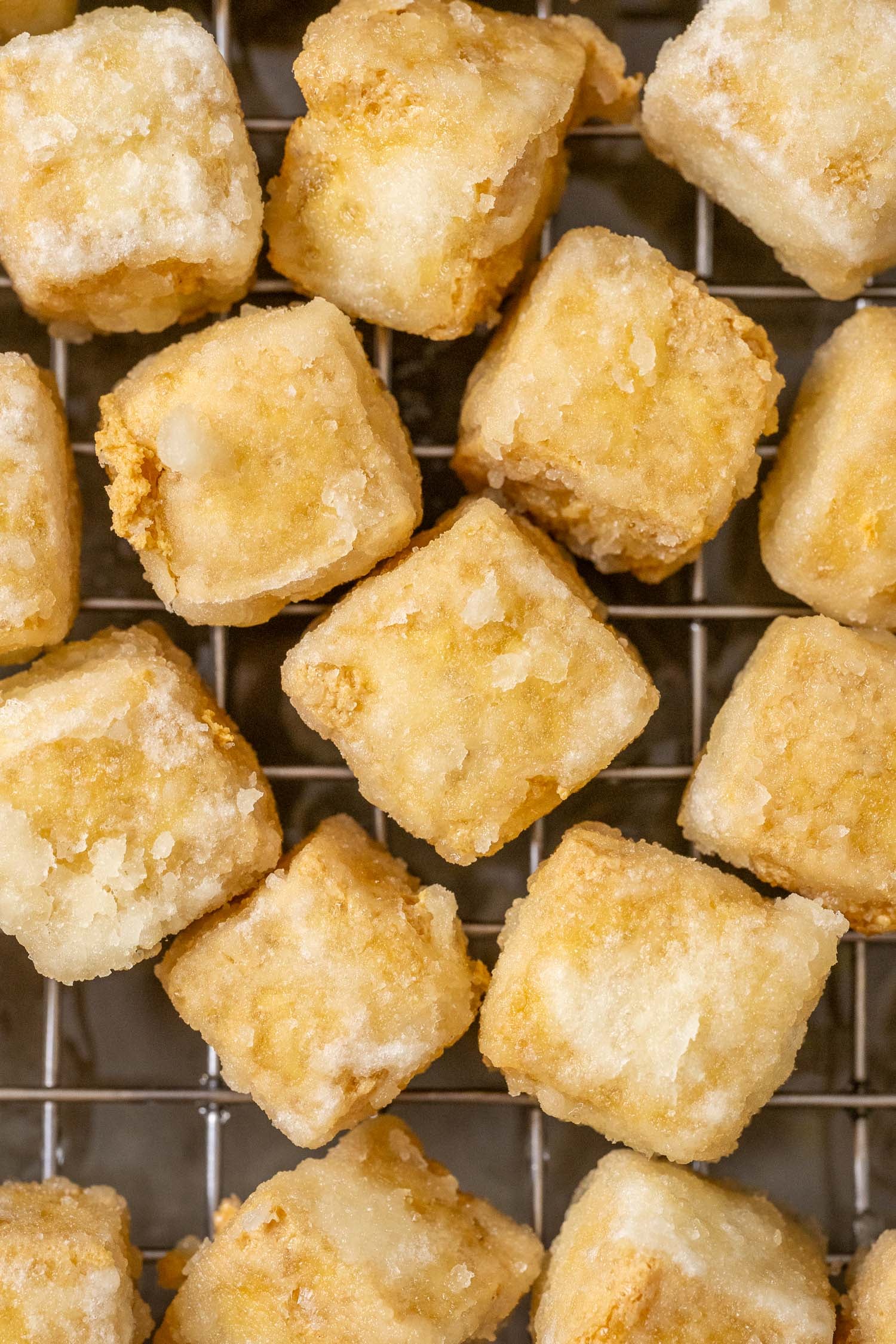 crispy fried tofu on a wire rack