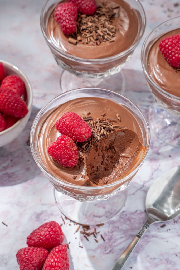 a cup of silken tofu chocolate mousse with a spoonful missing