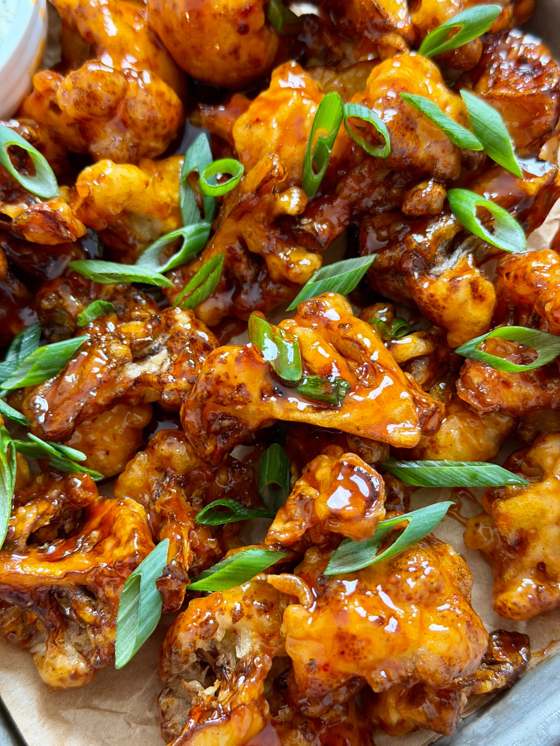 fried cauliflower tossed in spicy maple sauce