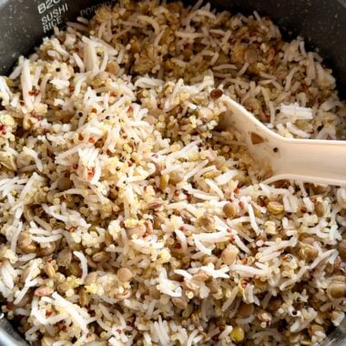rice cooker with freshly cooked and fluffed lentil and quinoa rice