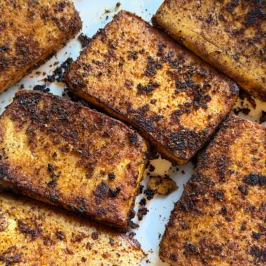 slabs of blackened tofu on a plate