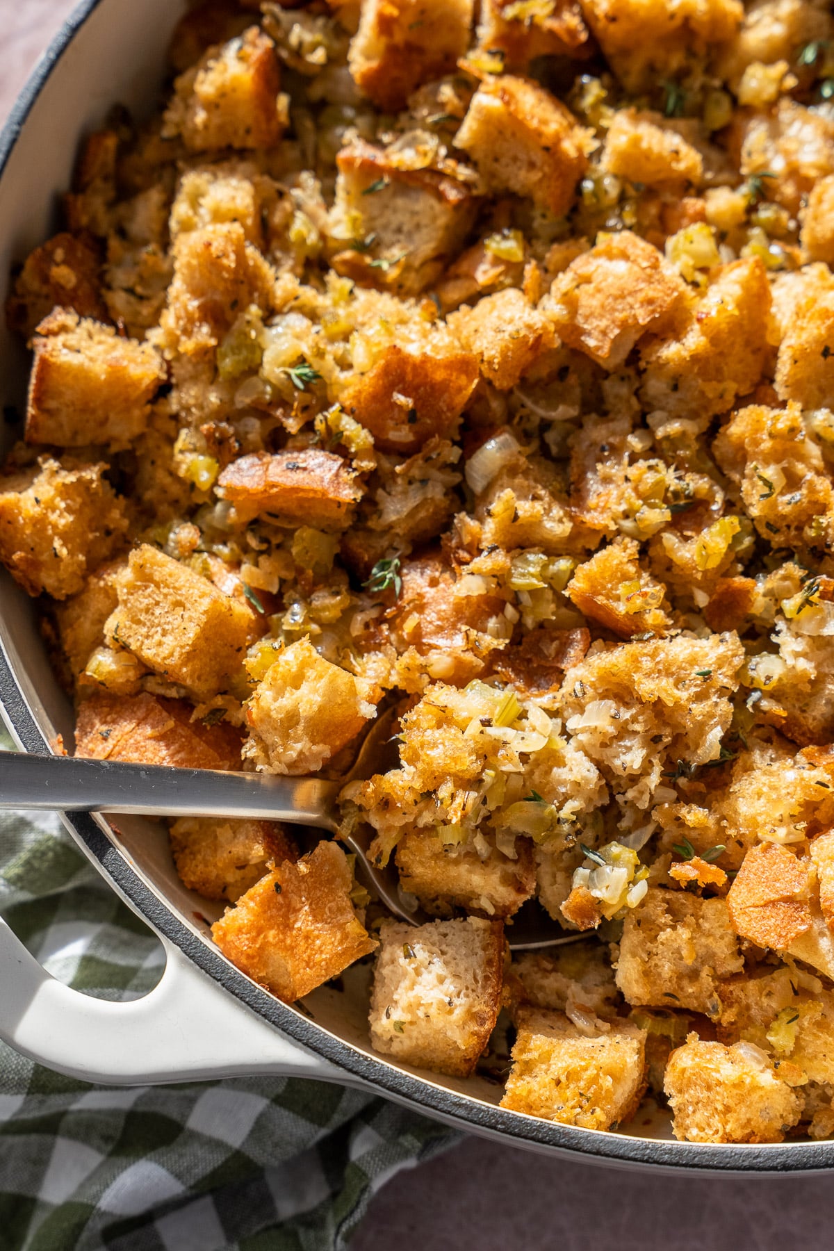 Vegan stuffing close up with a spoon taking some out.
